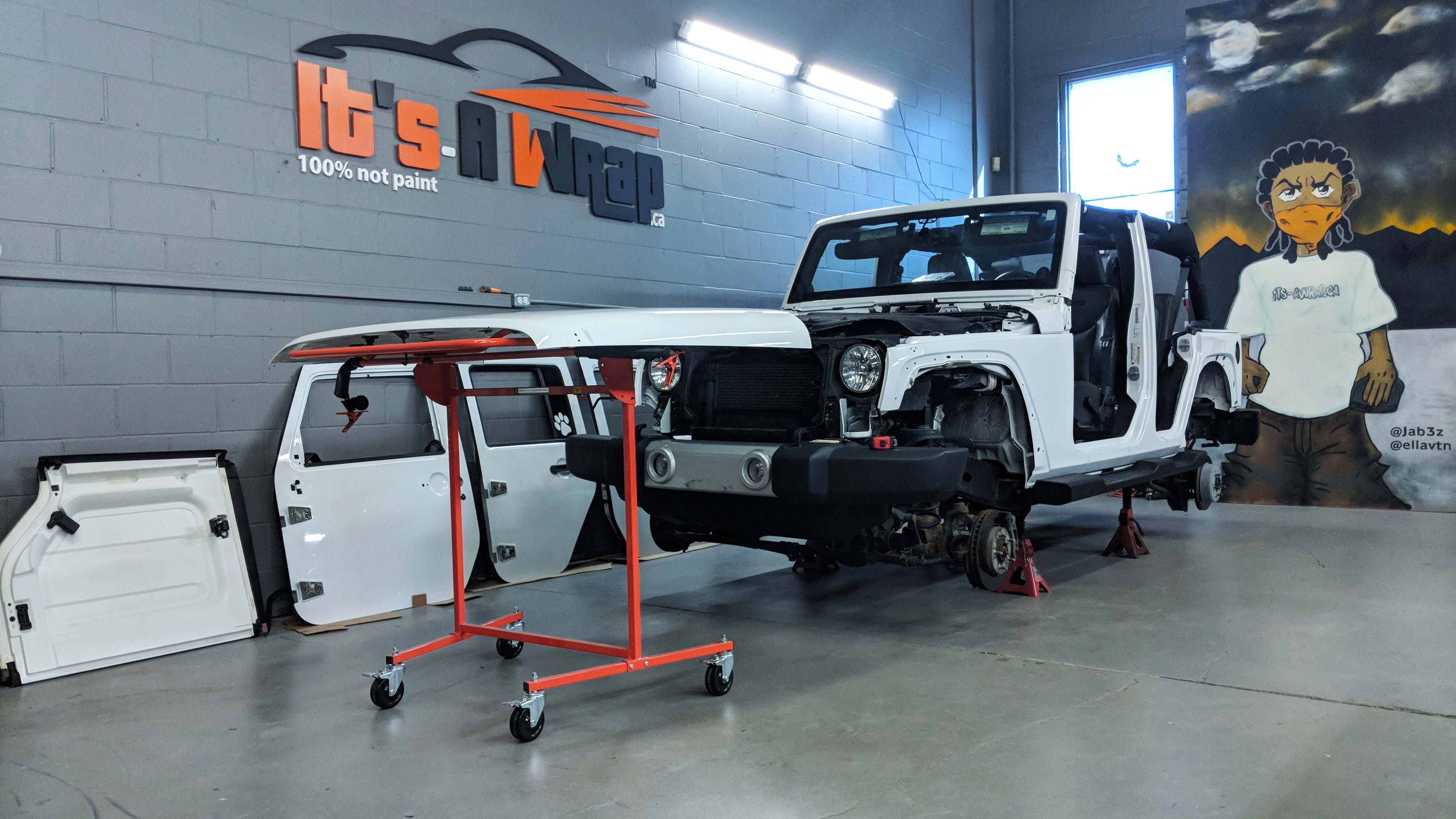 Jeep wrangler prepped and ready to be wrapped satin bubble pink