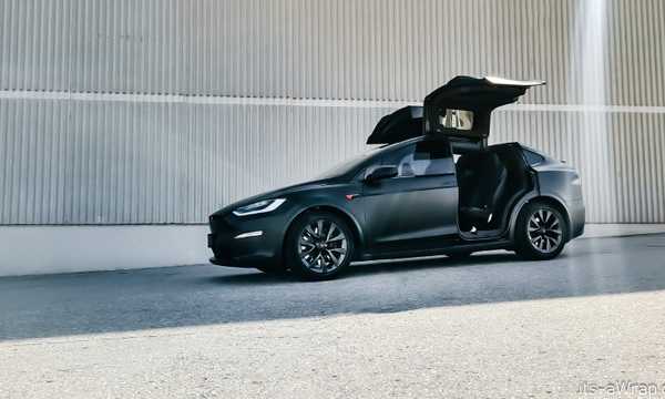 Tesla Model X matt black car wrap with red accents